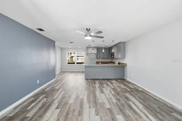 a view of a kitchen with a sink and cabinets