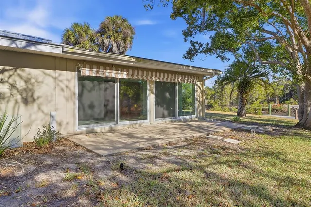 a view of a house with a tree