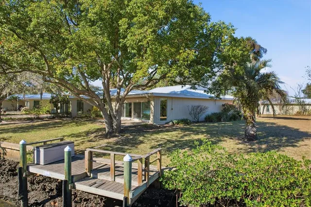 a view of house with backyard space and garden