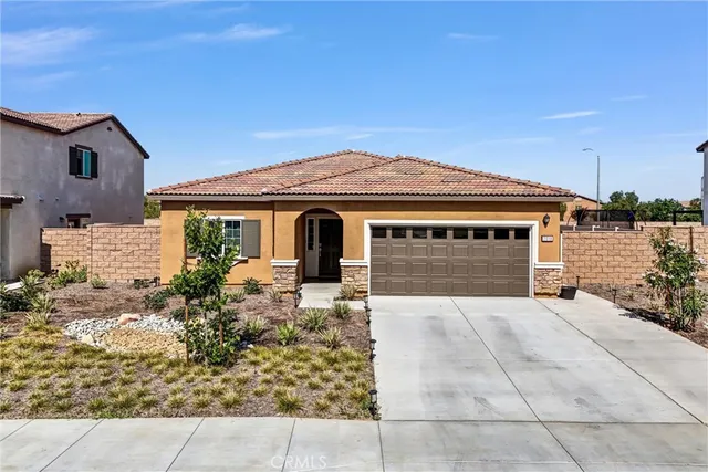 a front view of house with yard outdoor seating and barbeque oven