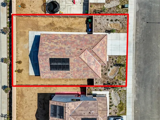 an aerial view of residential house with outdoor space