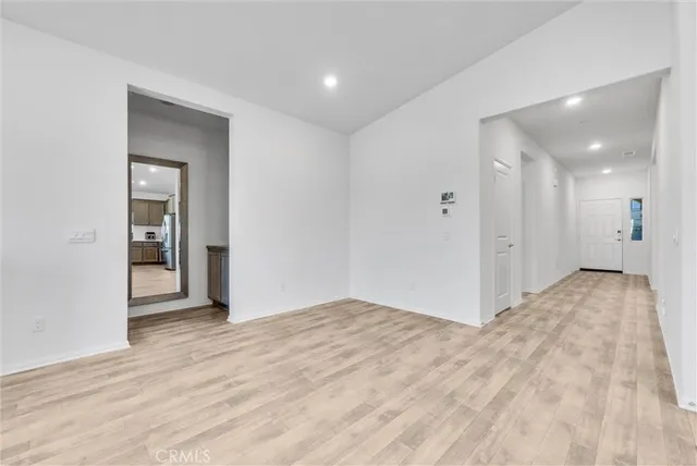 a view of hallway with wooden floor