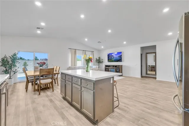 a view of kitchen with cabinets and wooden floor