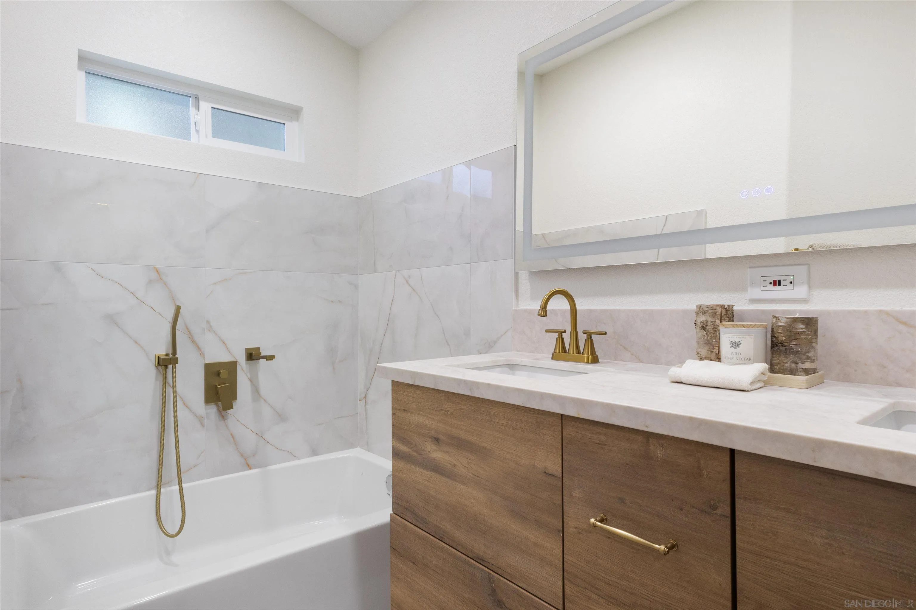 4350 Point Reyes Court Carlsbad, CA 92010 - Photo 19 of 33 a bathroom with a granite countertop sink and a mirror