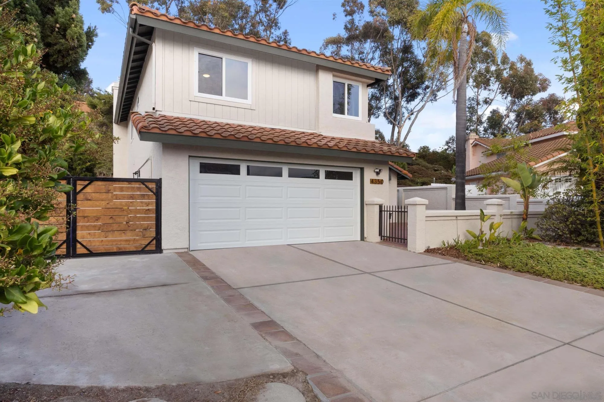 4350 Point Reyes Court Carlsbad, CA 92010 - Photo 2 of 33 a front view of a house with garage