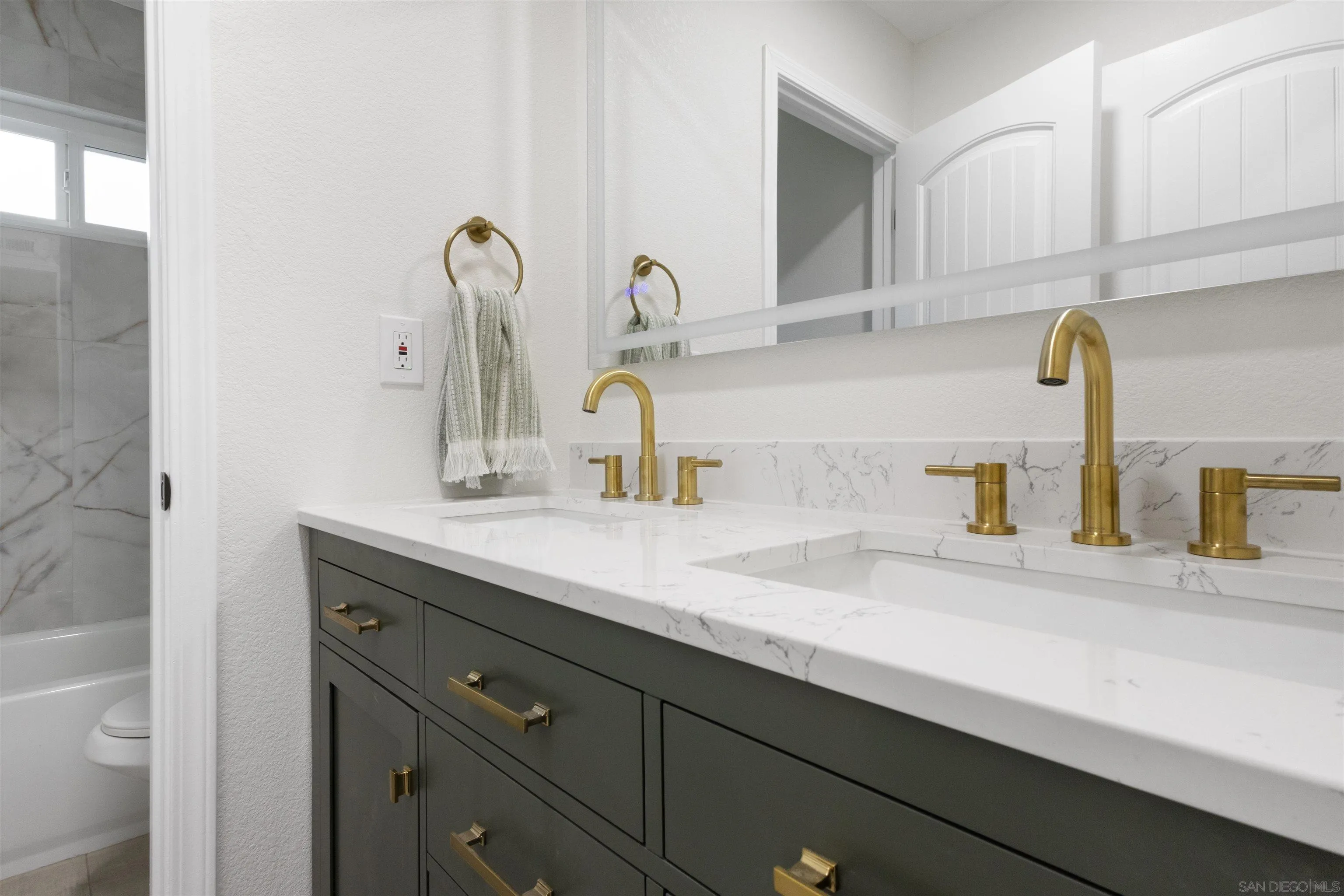 4350 Point Reyes Court Carlsbad, CA 92010 - Photo 21 of 33 a bathroom with a sink and a mirror