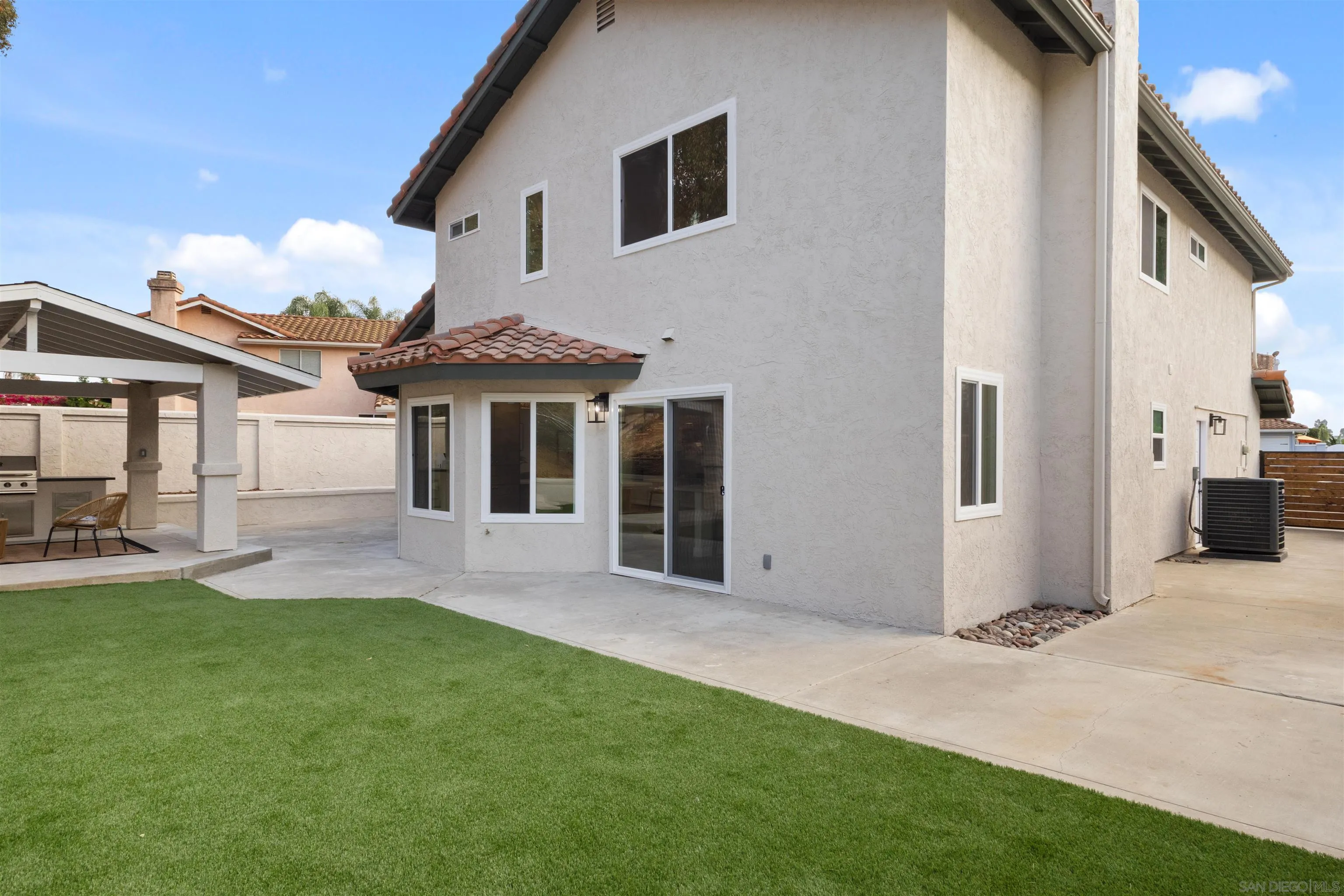 4350 Point Reyes Court Carlsbad, CA 92010 - Photo 27 of 33 a front view of a house with a yard and porch