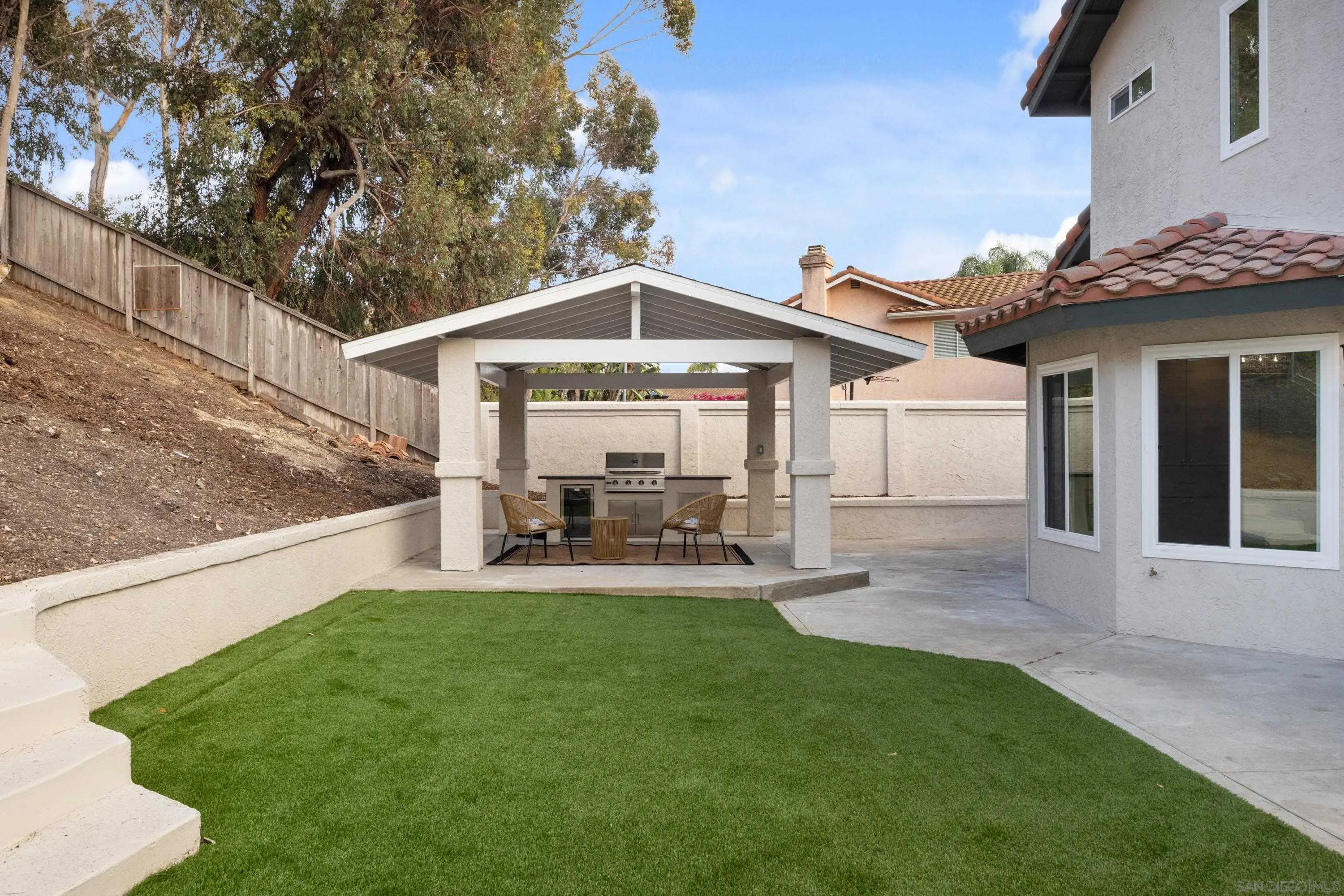 4350 Point Reyes Court Carlsbad, CA 92010 - Photo 30 of 33 a front view of a house with patio and yard