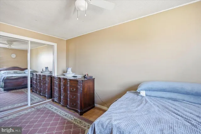 a bedroom with a bed and a cabinets