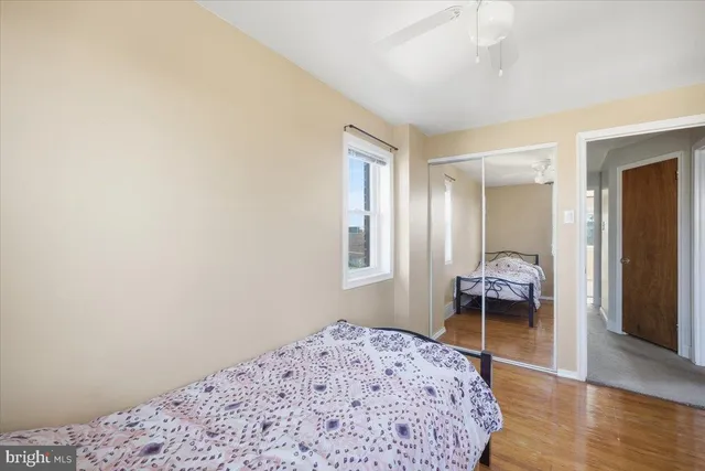 a bedroom with a bed and a chair