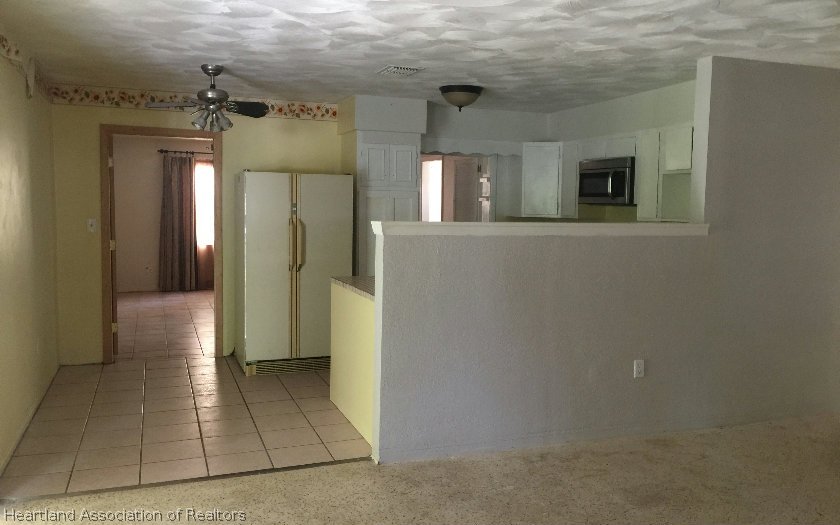 3905 Lakewood Road Sebring, FL 33875 - Photo 4 of 18 a view of livingroom with hardwood floor and a hallway