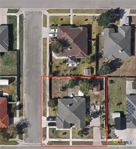 an aerial view of houses with outdoor space