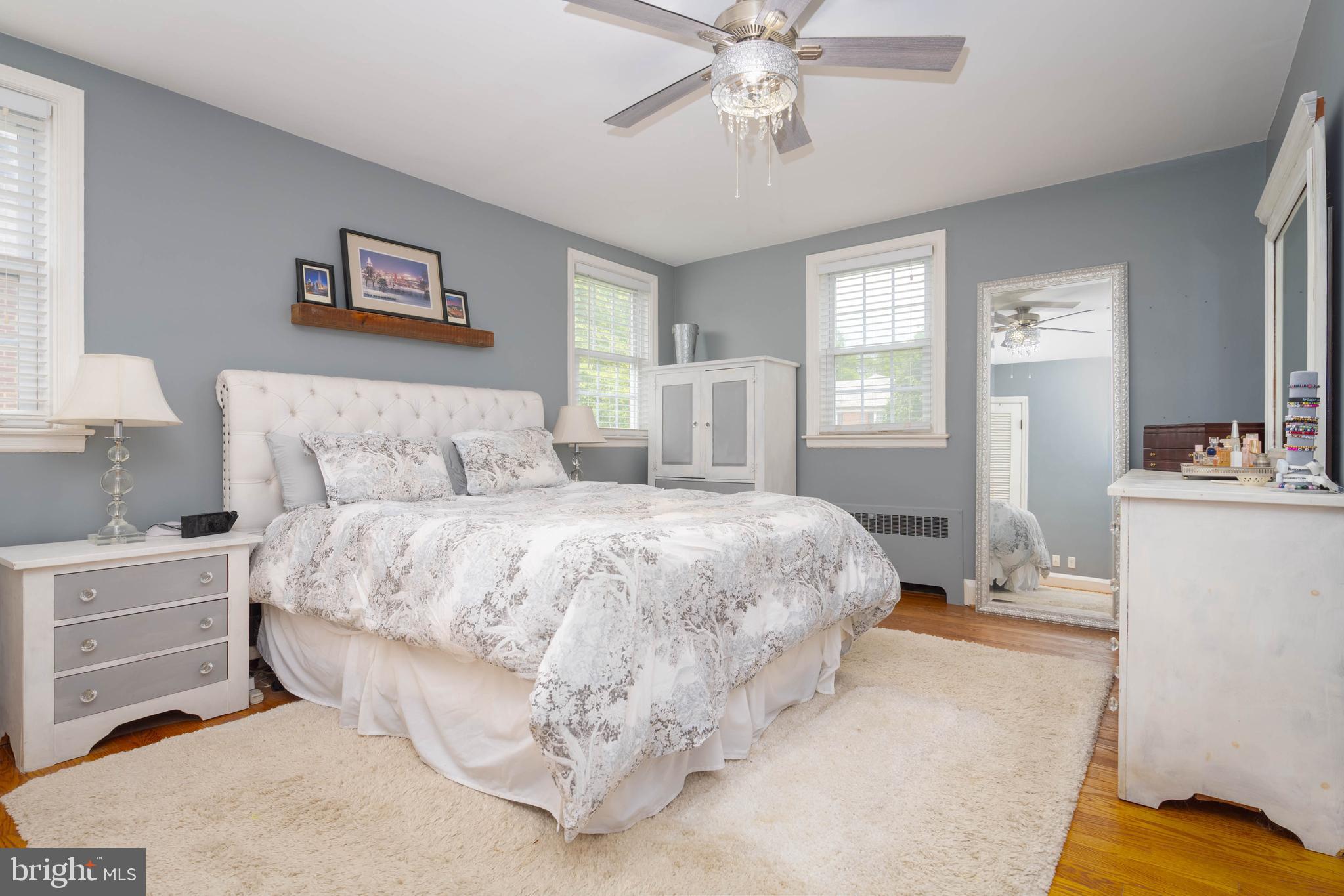 409 Regester Avenue Baltimore, MD 21212 - Photo 19 of 44 a bedroom with a bed and a chandelier