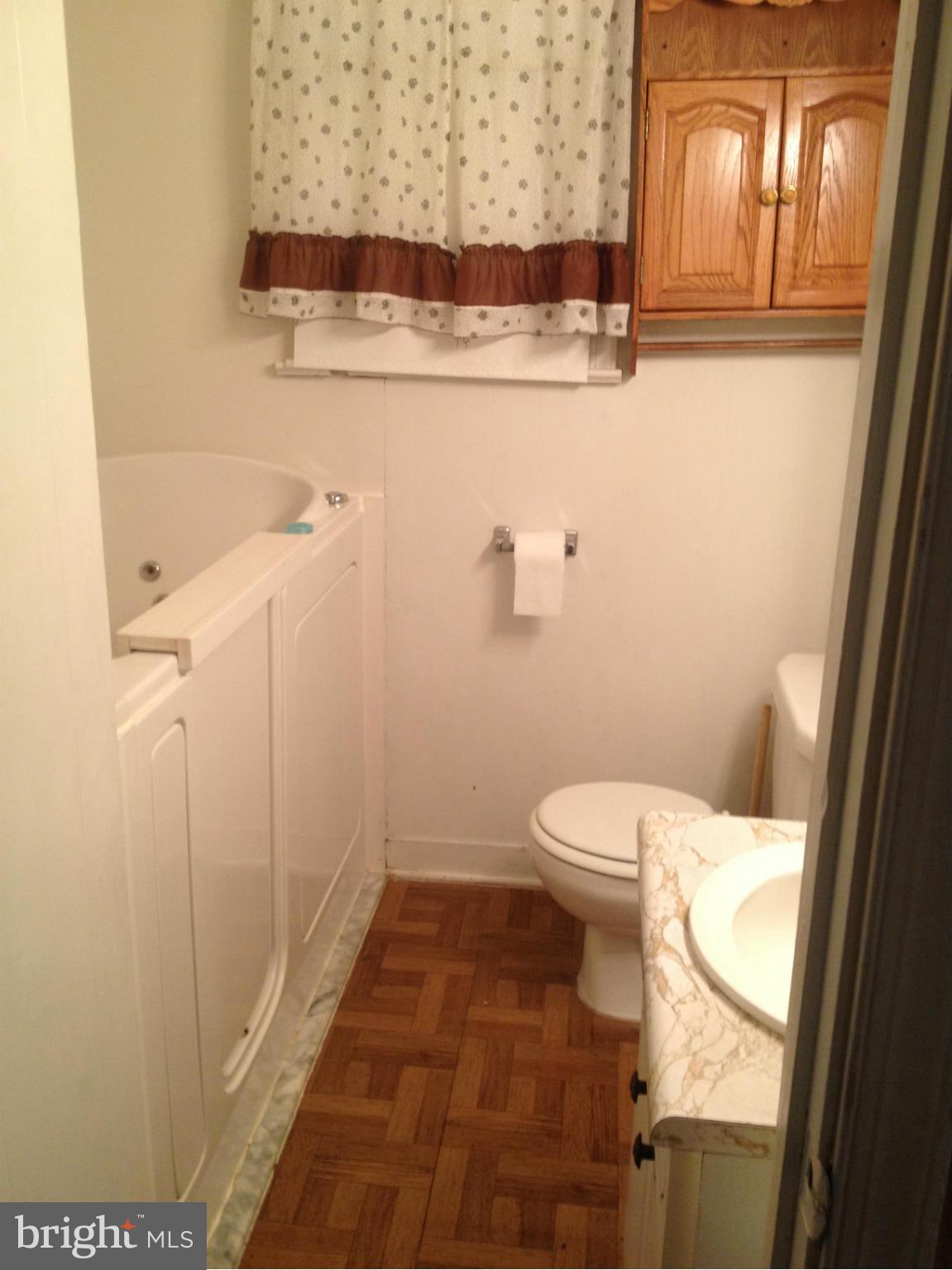 25141 Old Hundred Road Dickerson, MD 20842 - Photo 8 of 15 a bathroom with a toilet and a shower
