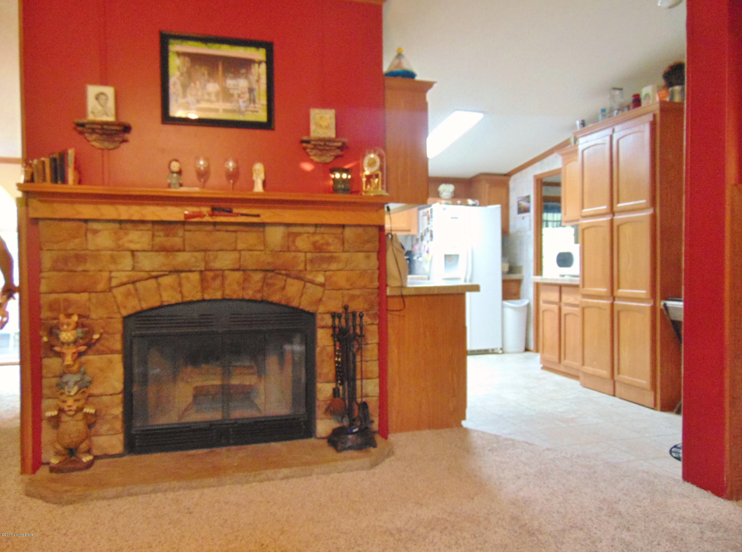 532 West Prong Locust Road Milton, KY 40045 - Photo 14 of 24 Looking from inside the living room towards the wood burning fire place.