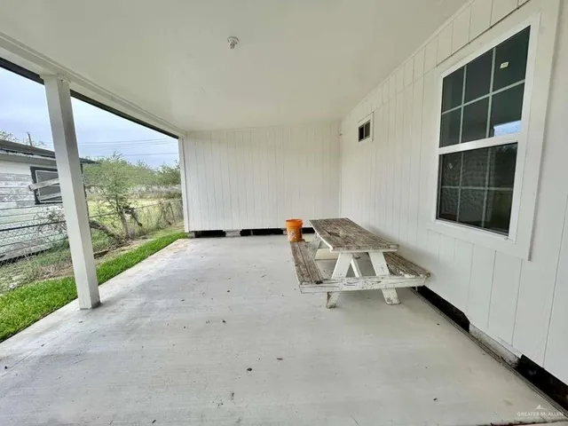 a view of a room with a large window