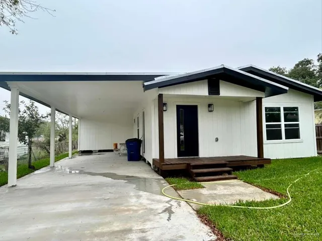 a front view of a house with yard