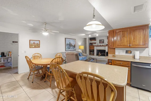 a dining room with furniture and window