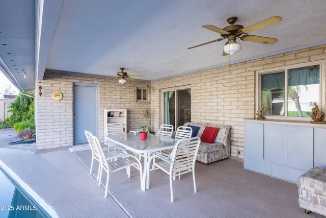 a view of a livingroom with furniture and a window