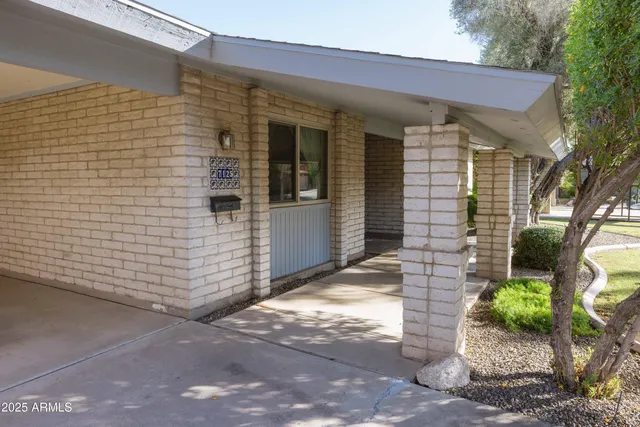 a view of a house with a garden