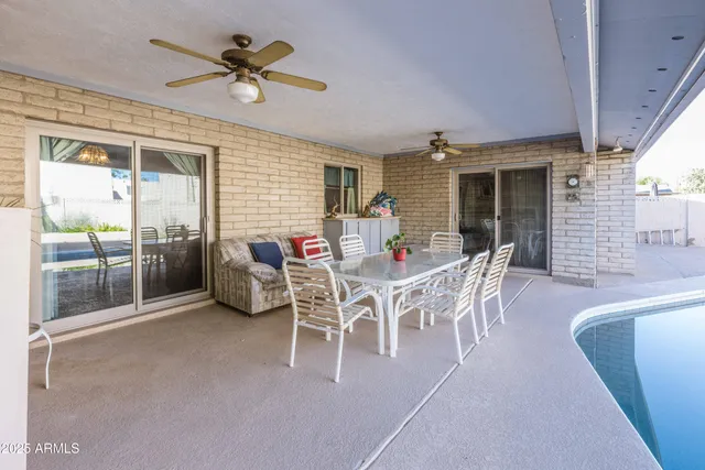 a dining room with furniture and window