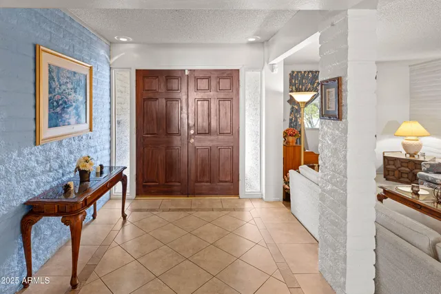 a view of an entryway and livingroom