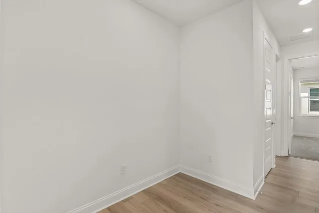 a view of a small space with wooden floor