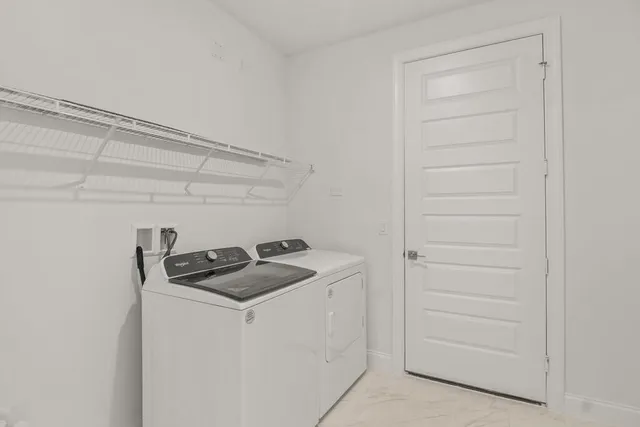 a bathroom with a granite countertop sink and cabinets
