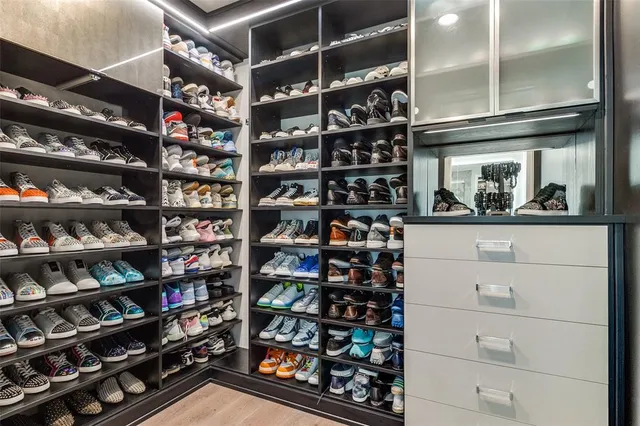 a room with shelves on the wall and shelf