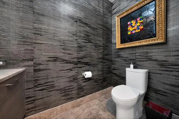 a bathroom with a toilet and a sink