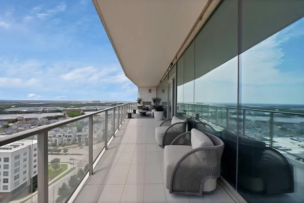 a view of balcony with furniture