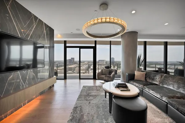 a living room with furniture and a large window