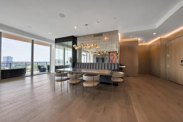 a lobby with furniture and floor to ceiling window