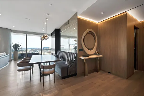 a view of a livingroom with furniture and a floor to ceiling window