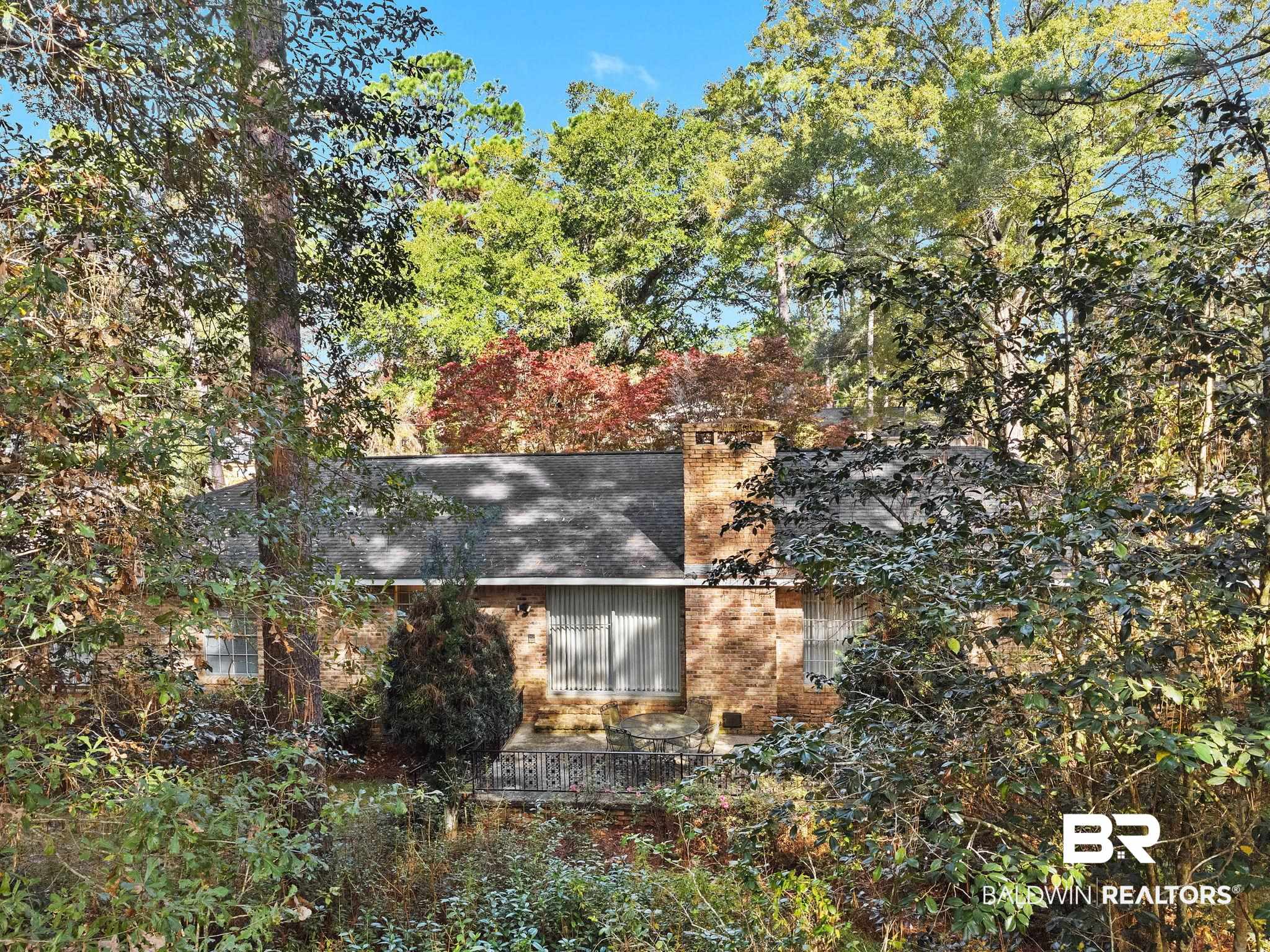 752 Evergreen Street Fairhope, AL 36532 - Photo 55 of 100 View of home's exterior with brick siding and a chimney