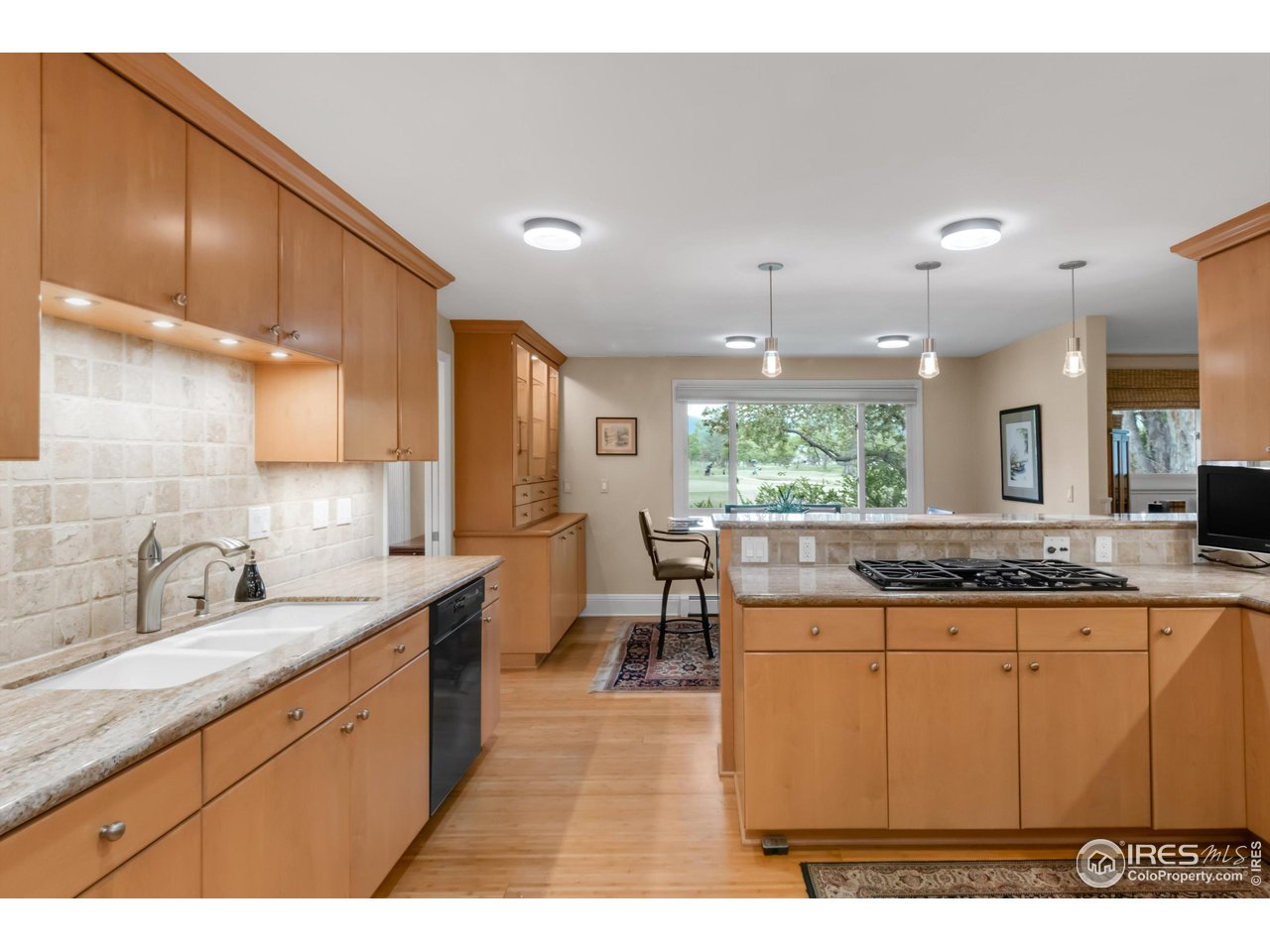 1409 Old Tale Road Boulder, CO 80303 - Photo 12 of 40 a large bathroom with a granite countertop sink a toilet a large mirror and vanity