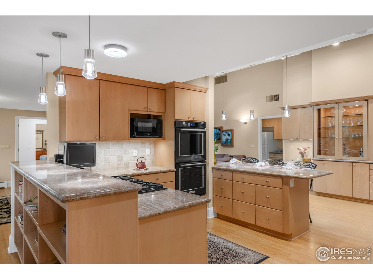 1409 Old Tale Road Boulder, CO 80303 - Photo 13 of 40 a kitchen with stainless steel appliances granite countertop a sink stove and refrigerator