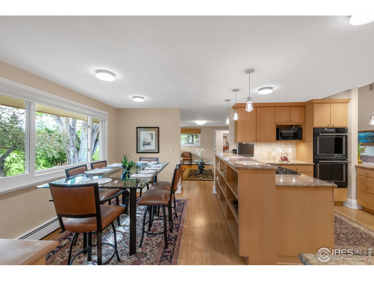 1409 Old Tale Road Boulder, CO 80303 - Photo 14 of 40 a view of a dining room with furniture window and outside view