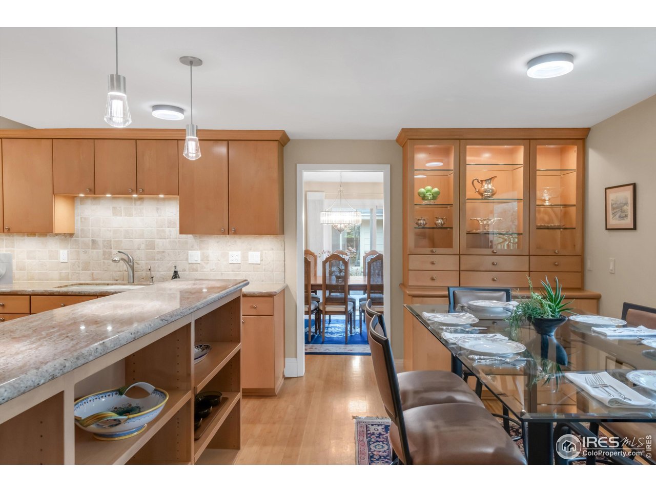 1409 Old Tale Road Boulder, CO 80303 - Photo 17 of 40 a kitchen with a table chairs and a view of living room