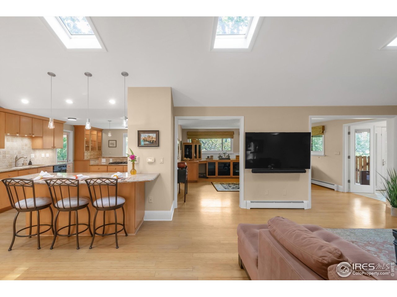 1409 Old Tale Road Boulder, CO 80303 - Photo 21 of 40 a living room with furniture and a flat screen tv