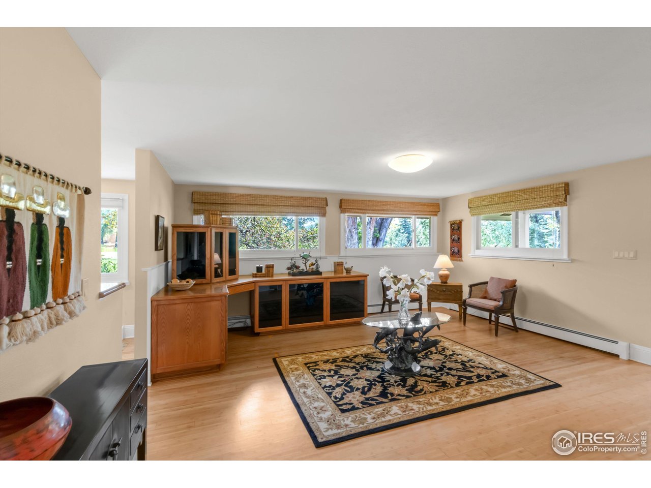 1409 Old Tale Road Boulder, CO 80303 - Photo 22 of 40 a living room with furniture flat screen tv and window
