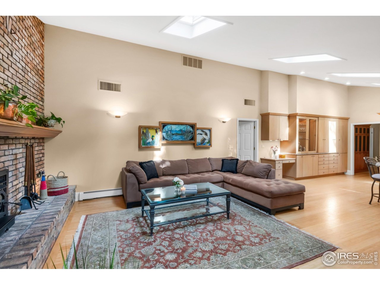 1409 Old Tale Road Boulder, CO 80303 - Photo 25 of 40 a living room with furniture and a wooden floor
