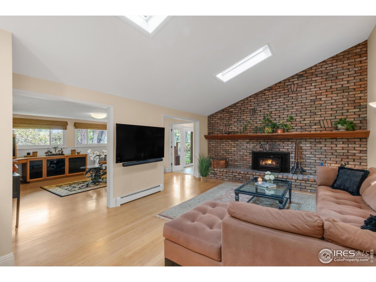 1409 Old Tale Road Boulder, CO 80303 - Photo 26 of 40 a living room with furniture and a flat screen tv
