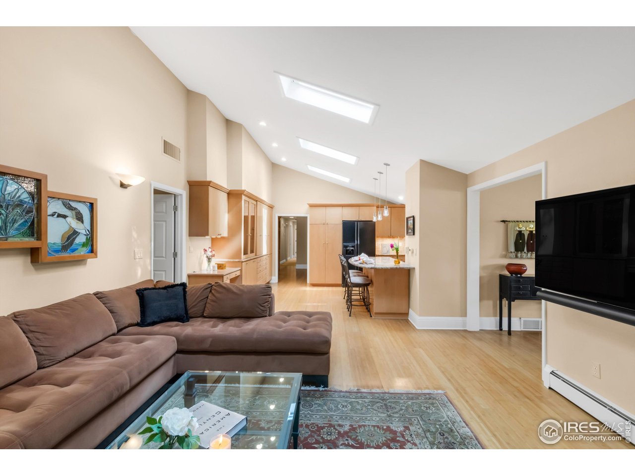 1409 Old Tale Road Boulder, CO 80303 - Photo 27 of 40 a living room with furniture and a flat screen tv