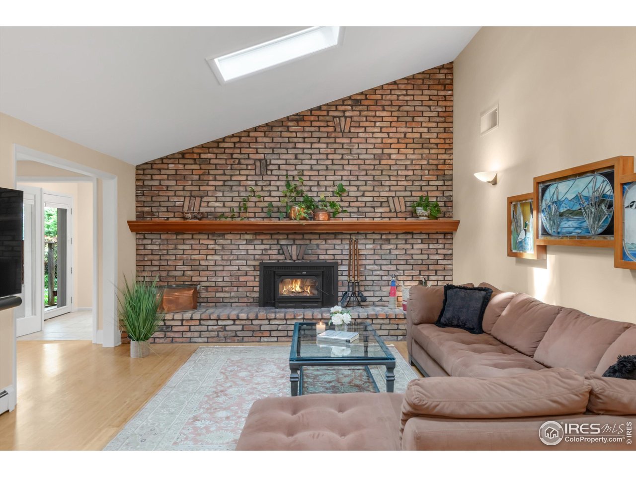 1409 Old Tale Road Boulder, CO 80303 - Photo 28 of 40 a living room with furniture and a fireplace