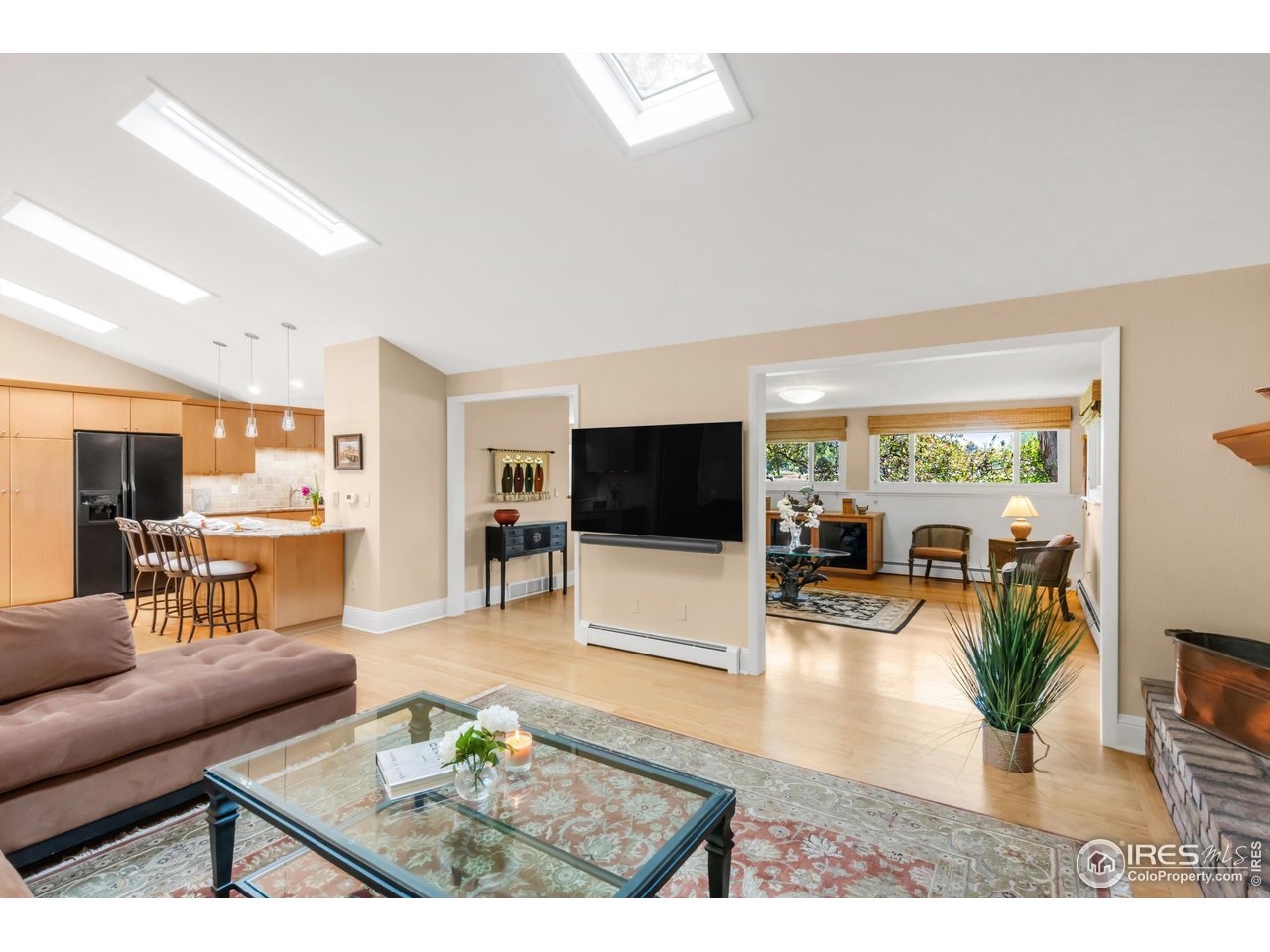 1409 Old Tale Road Boulder, CO 80303 - Photo 30 of 40 a living room with furniture and a flat screen tv