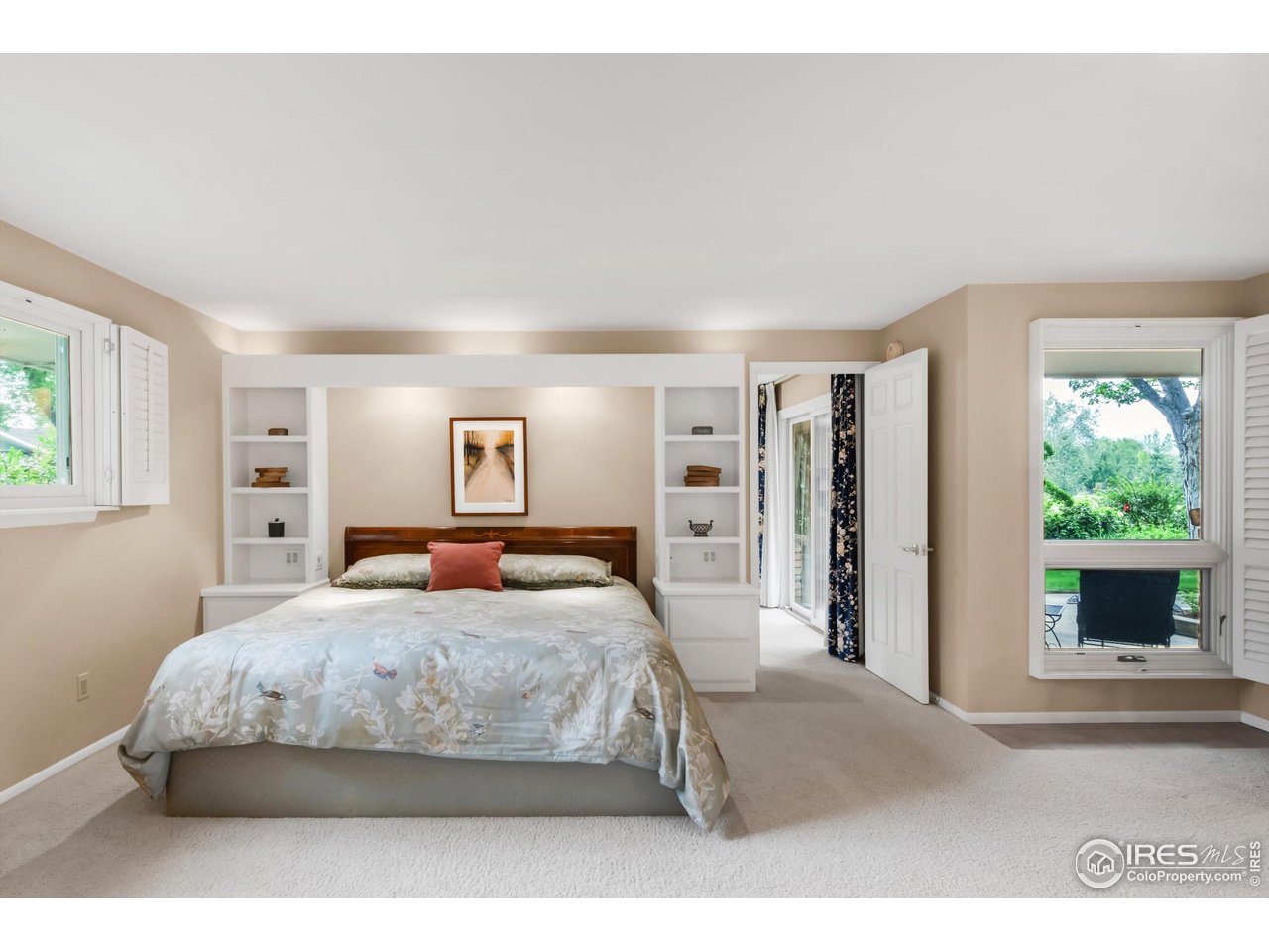 1409 Old Tale Road Boulder, CO 80303 - Photo 34 of 40 a bedroom with a large bed and a window