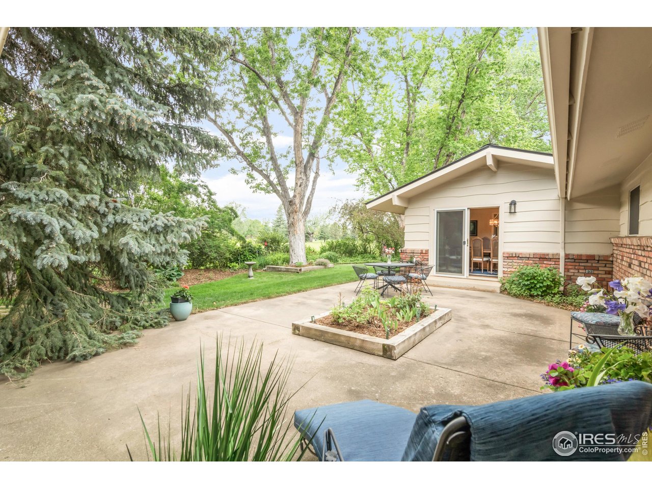 1409 Old Tale Road Boulder, CO 80303 - Photo 36 of 40 a view of a house with backyard and sitting area