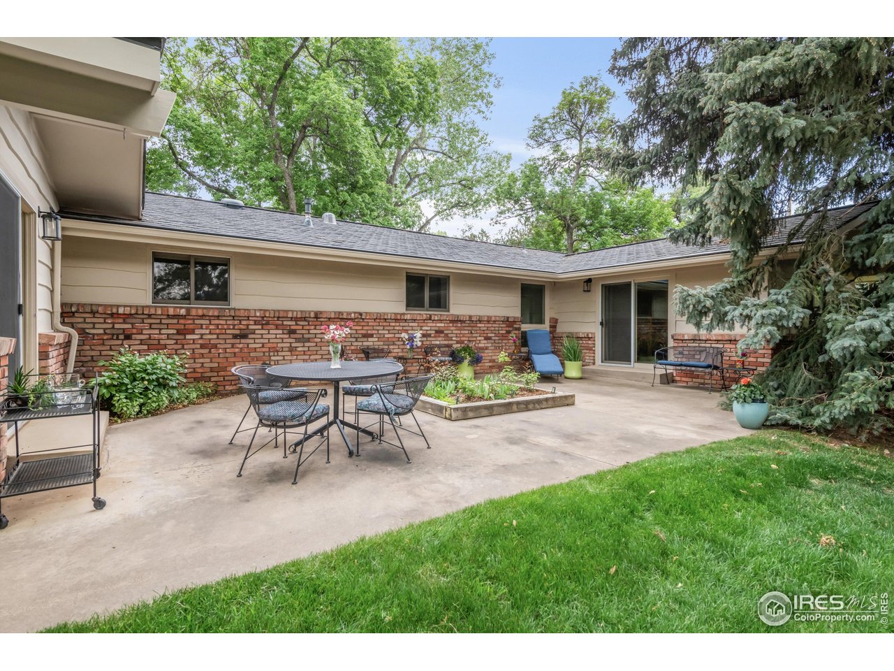 1409 Old Tale Road Boulder, CO 80303 - Photo 37 of 40 a view of a house with backyard and sitting area