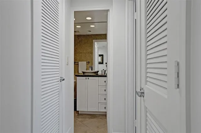a view of a bathroom from the hallway